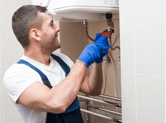 HVAC technician performing heating furnace repair and maintenance